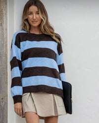 Woman wearing a chocolate and blue striped knit. Brady Bunch Knit. Soft, cotton blend knit. 