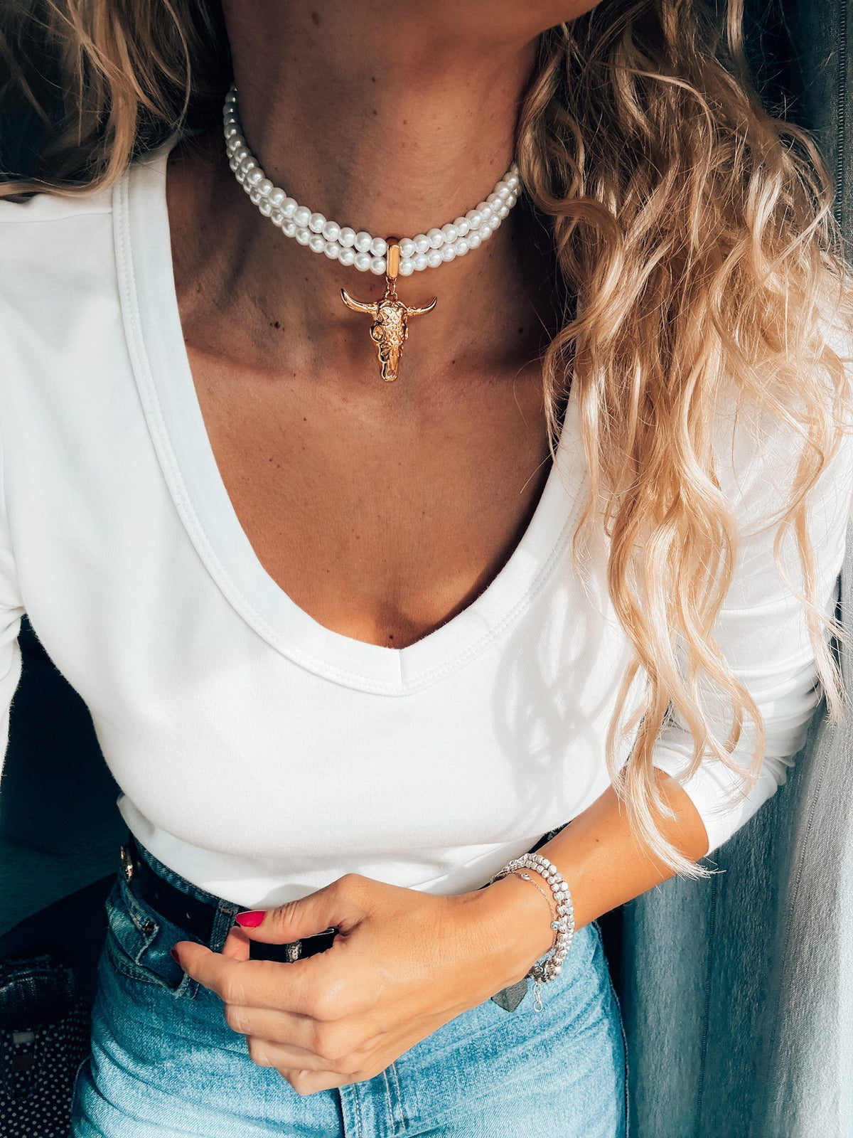 Double pearl choker with gold bull skull