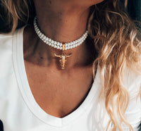 Double pearl choker with gold bull skull